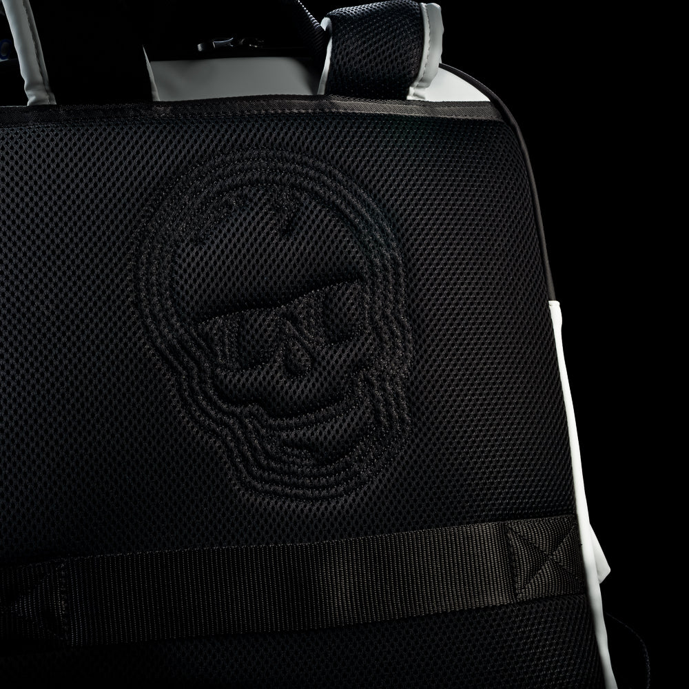 Close-up of the padded black back panel on the RWB Gigantic Lincoln Backpack featuring embossed skull artwork and textured detailing.