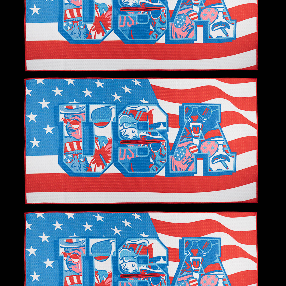 SWAG Golf USA golf towel featuring patriotic stars and stripes graphics with bold USA artwork in red, white, and blue.