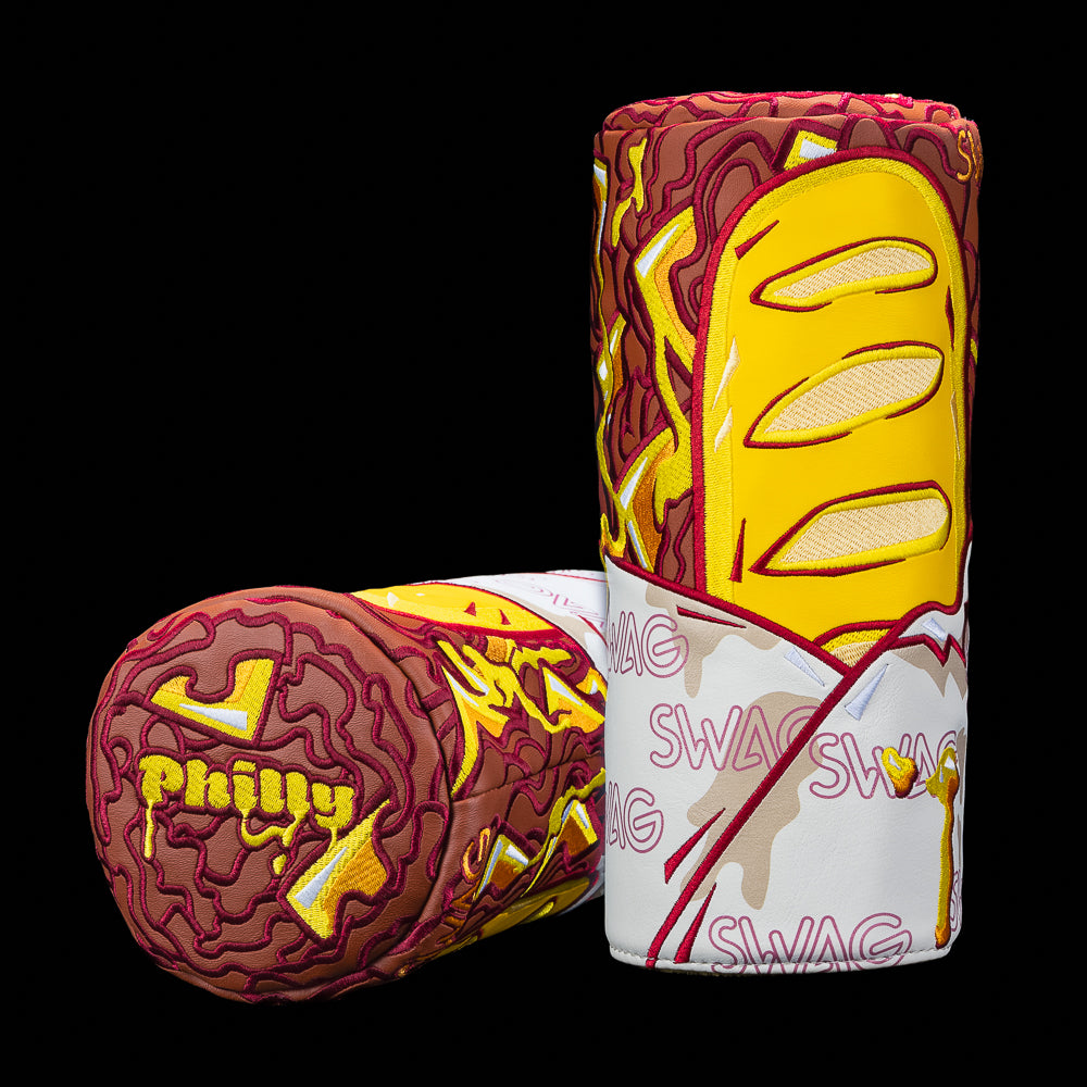 SWAG Golf Philly Cheesesteak barrel cover featuring melted cheese embroidery, cheesesteak meat graphics, dripping Philly lettering, and bold street-food inspired detailing on premium leather.
