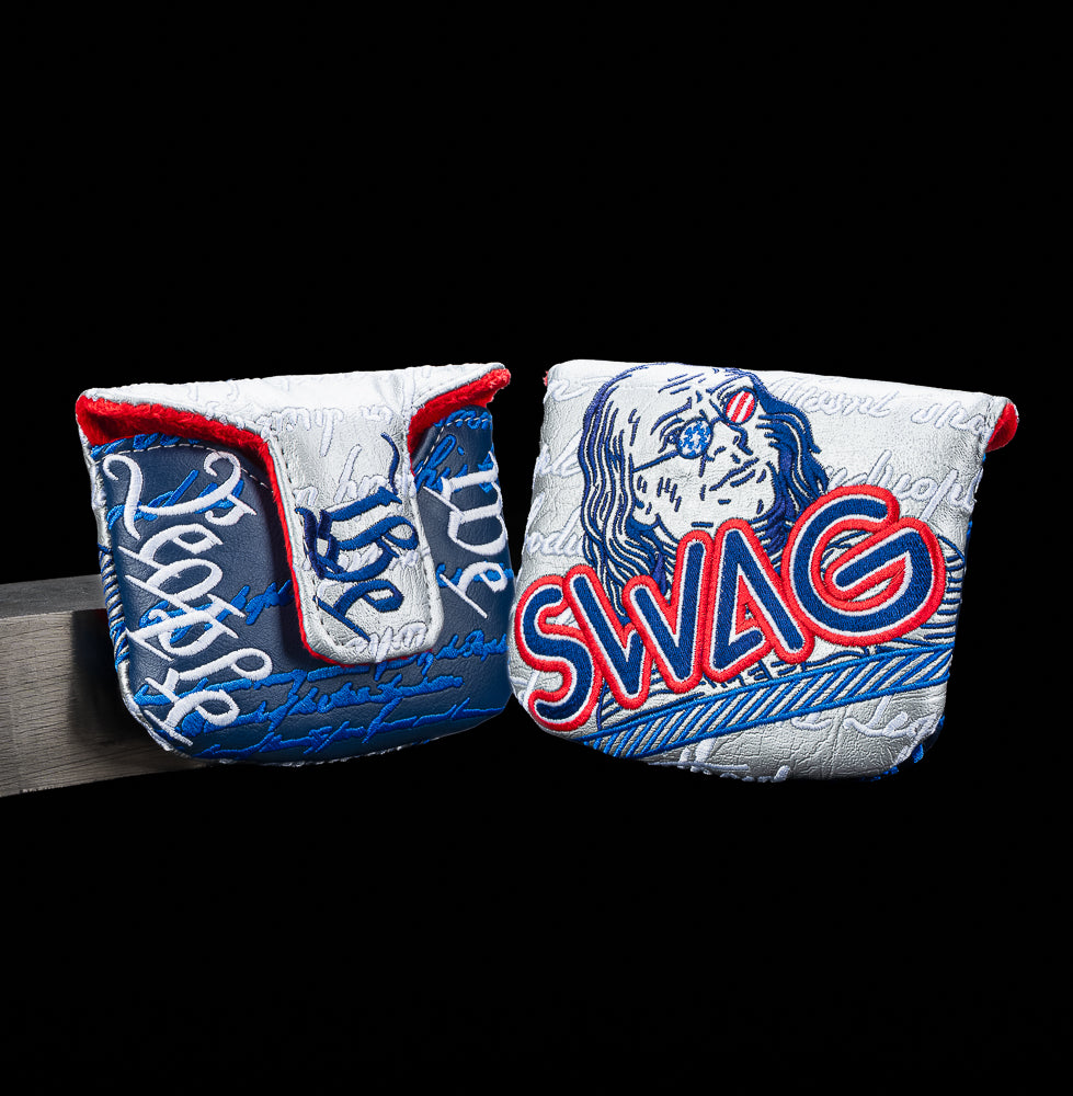 SWAG Golf We The People mallet cover featuring patriotic red white and blue embroidery, Benjamin Franklin artwork with star-spangled sunglasses, oversized SWAG logo, and textured currency inspired script detailing.