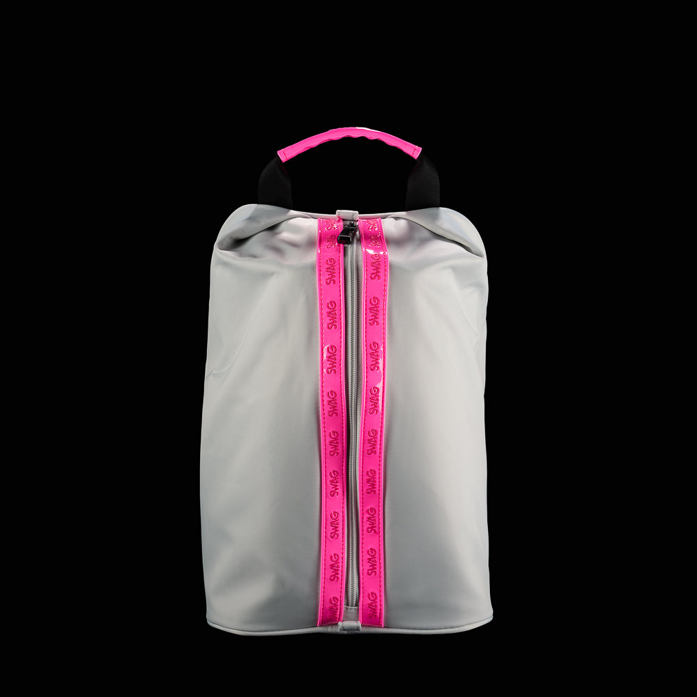 Gray golf shoe bag with bright pink SWAG zipper tracks, black carry handle, and minimalist performance design.
