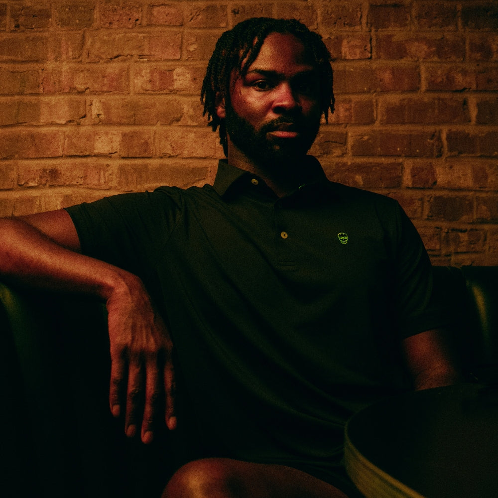 SWAG Golf Black Skull Classic Polo men's performance golf shirt with embroidered neon skull logo on chest