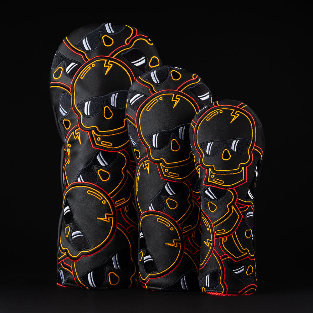Eclipse Orange Flare black and orange stacked skulls woods golf head cover set. Made in the USA.