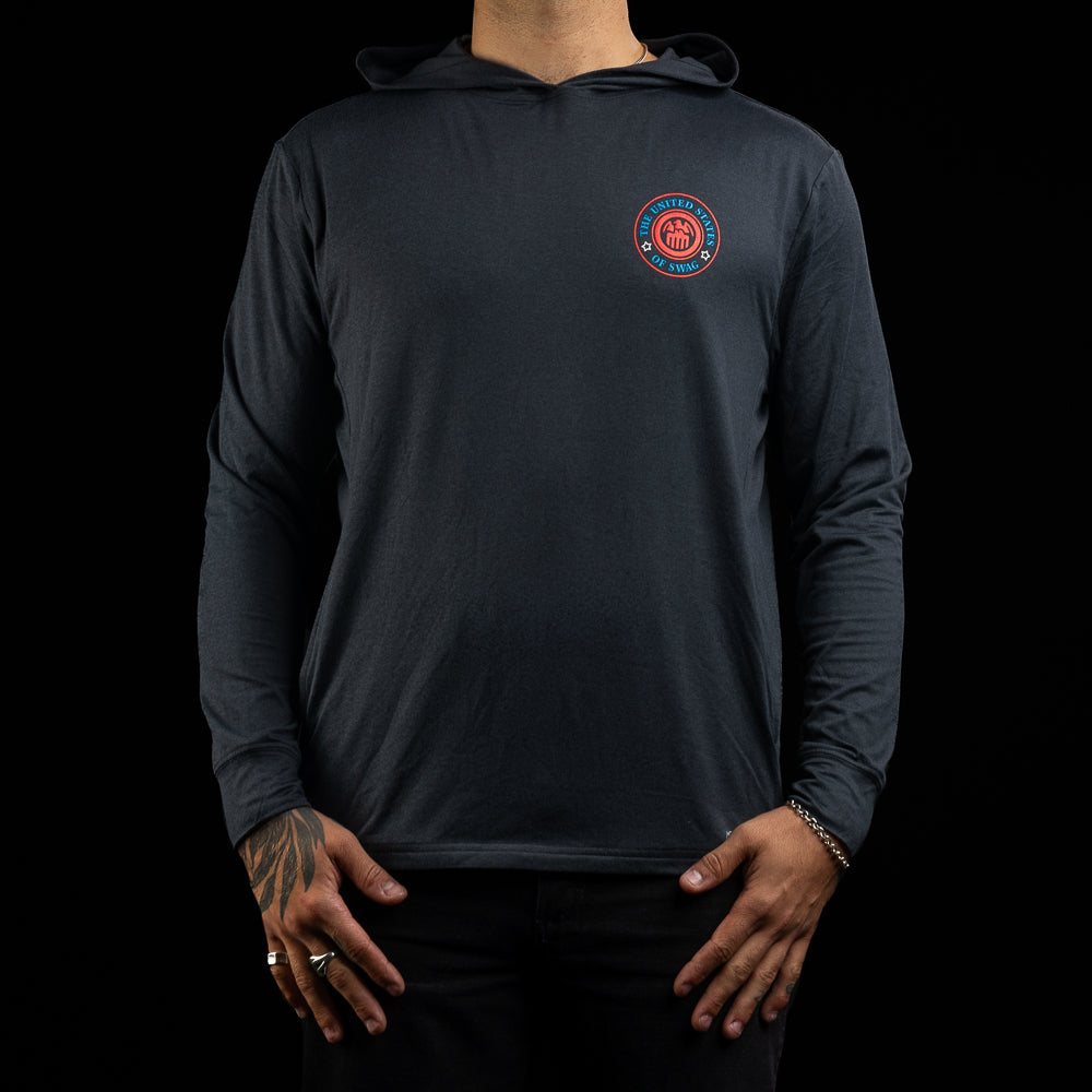 Person wearing a navy long-sleeve hoodie with a United States of SWAG logo on the chest against a black background