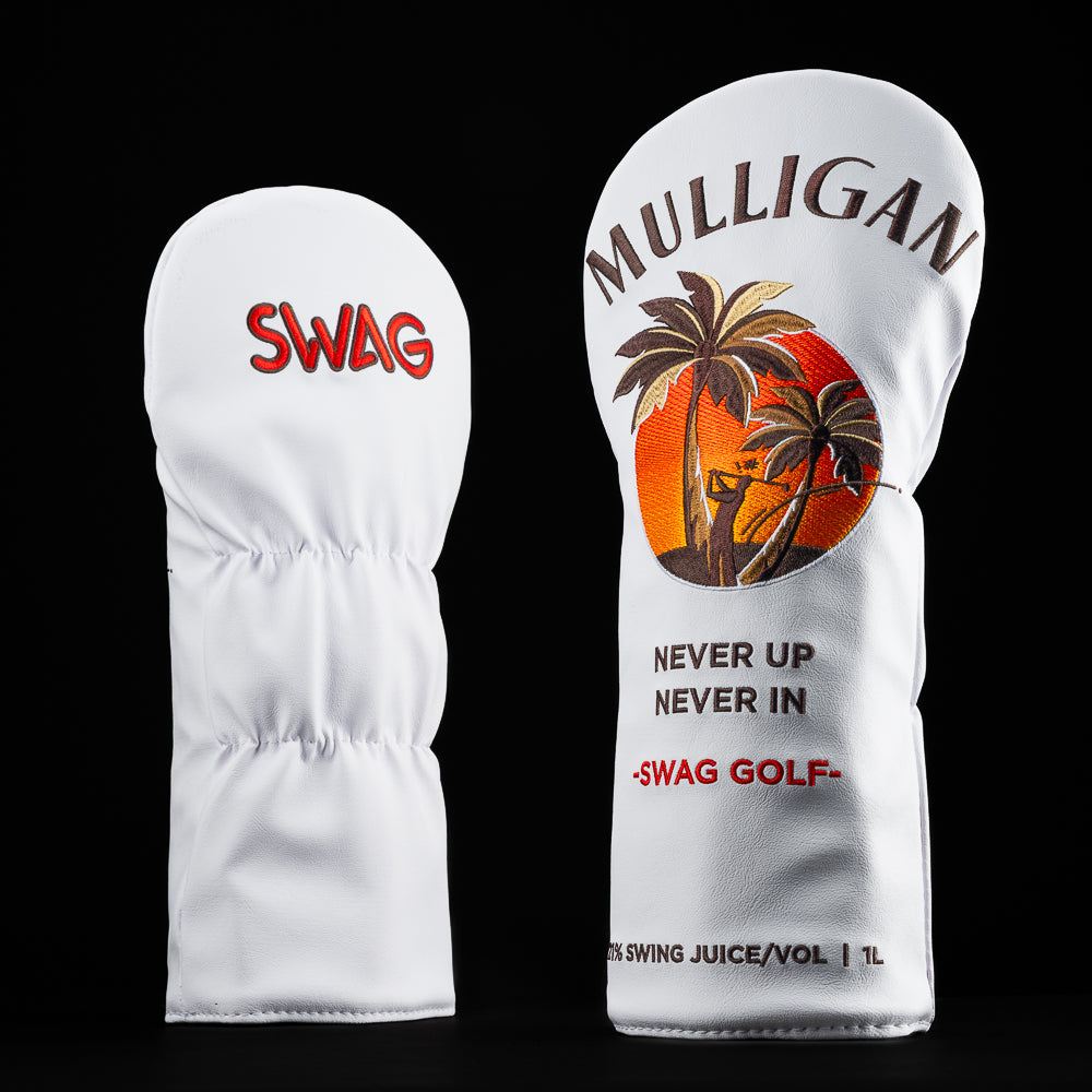 Mulligan Rum barrel driver cover with palm trees, sunset, and "Never Up Never In" phrase on white background.