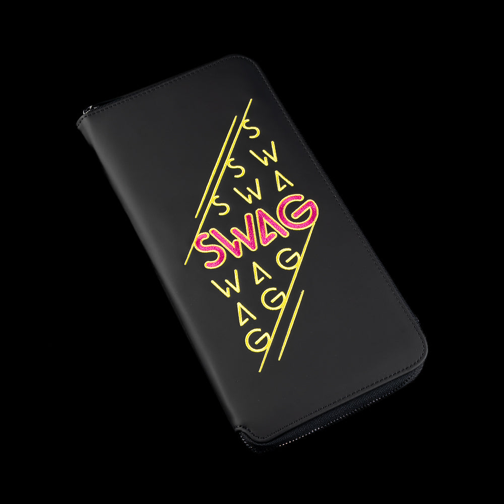 Black SWAG Golf glove folio featuring neon pink and yellow stacked SWAG graphics with premium zip-around leather construction.
