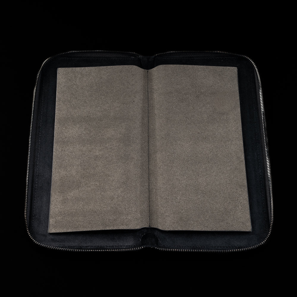 Open black SWAG Golf glove folio with soft suede interior lining designed to keep golf gloves flat and protected.