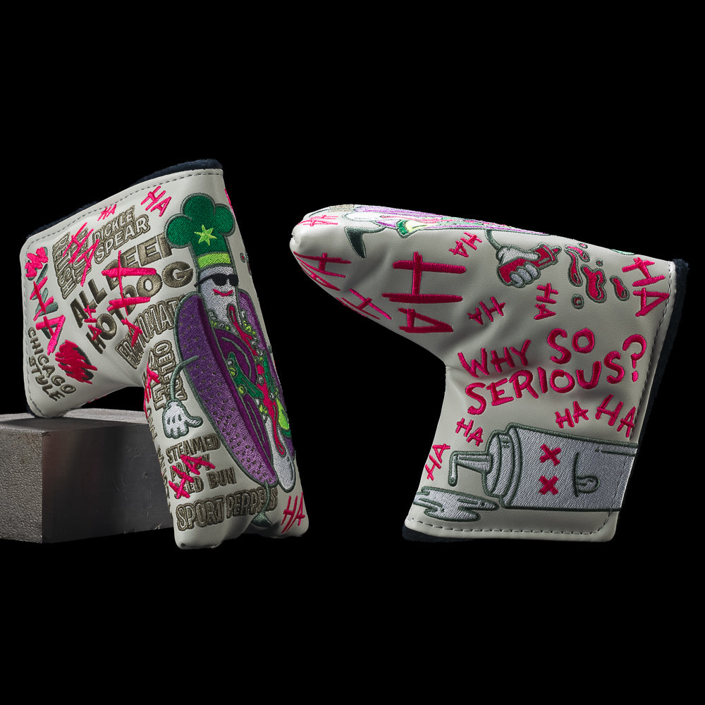 Two sides of SWAG Golf Defaced Chicago Dog blade cover with hot dog artwork, pink graffiti, and “Why so serious?” lettering.