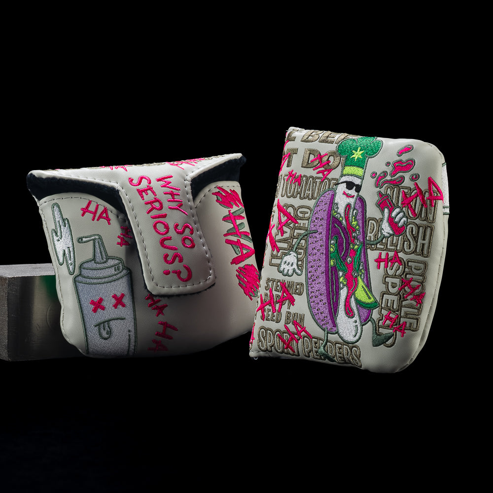 Front and back views of SWAG Golf Defaced Chicago Dog mallet cover with hot dog artwork, pink graffiti, and “Why so serious?” lettering.