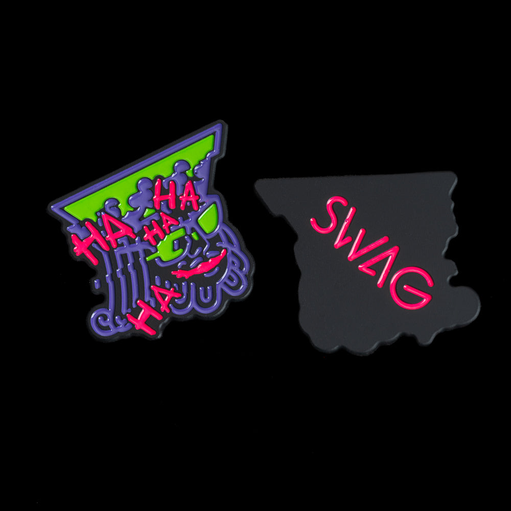 King-shaped ball marker with black border, purple royal face and crown details, neon-green sunglasses and top panel, and pink SWAG logo on the back.