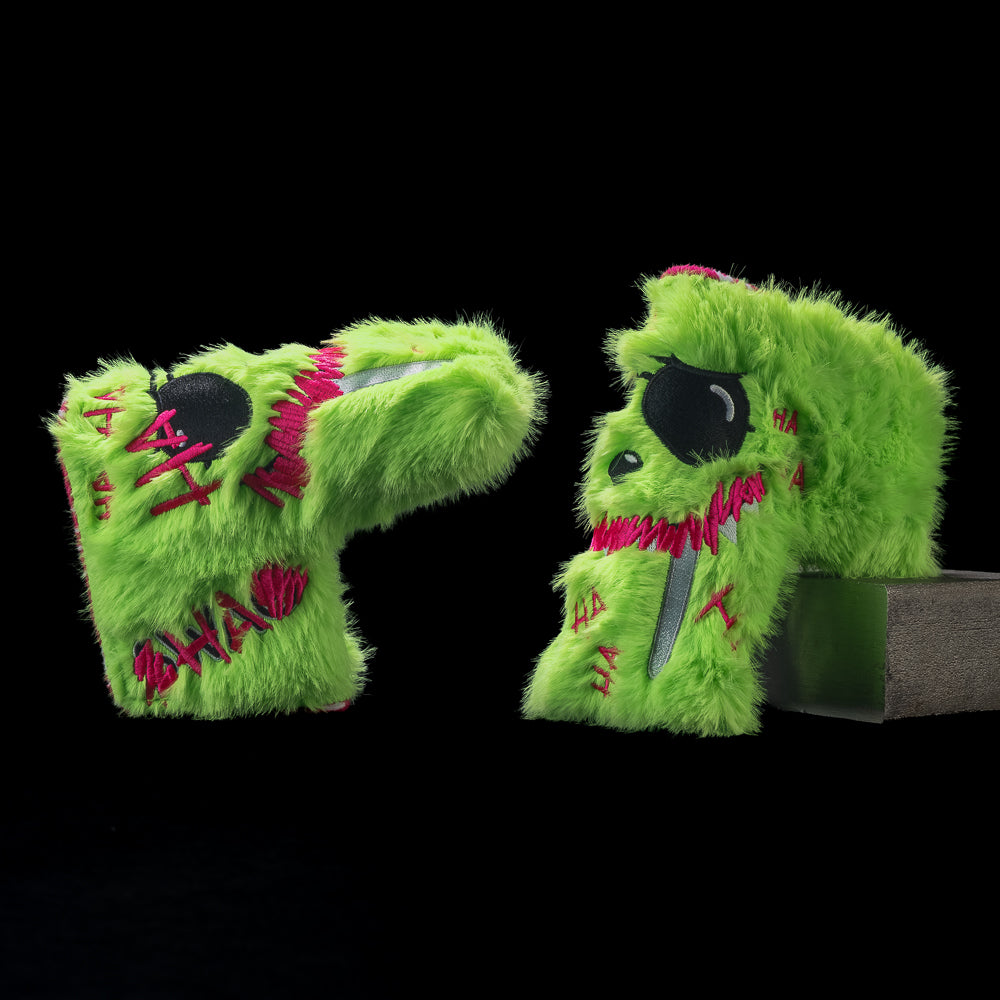 Two views of SWAG Golf Defaced LaBooster blade cover with neon-green fur, black eyes, a pink grin, and pink SWAG lettering.