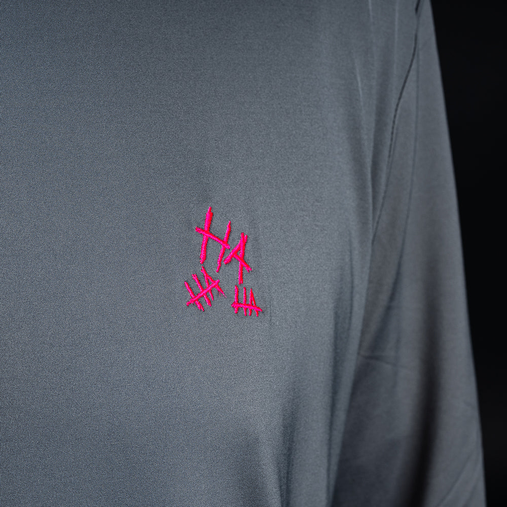 SWAG Golf gray men's long sleeve performance golf hoodie with HA HA HA embroidery over the left chest and signature neon SWAG skull over the right shoulder.