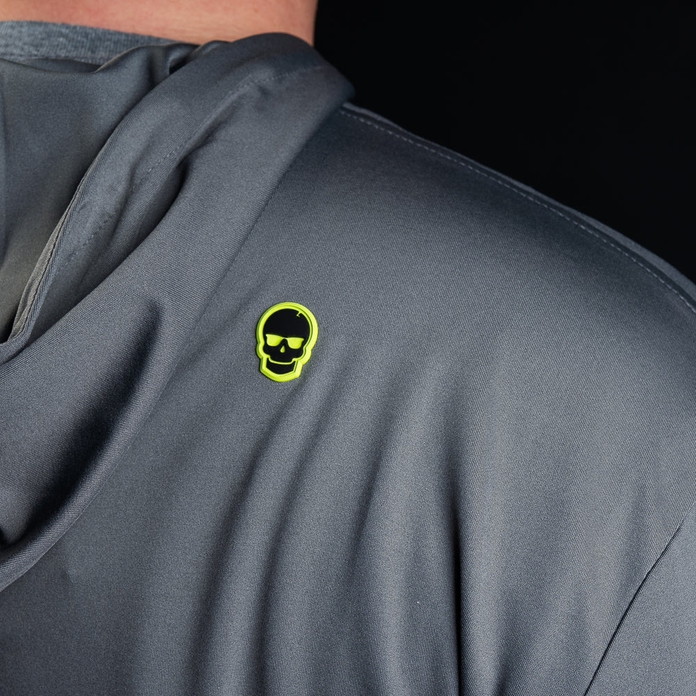 SWAG Golf gray men's long sleeve performance golf hoodie with HA HA HA embroidery over the left chest and signature neon SWAG skull over the right shoulder.