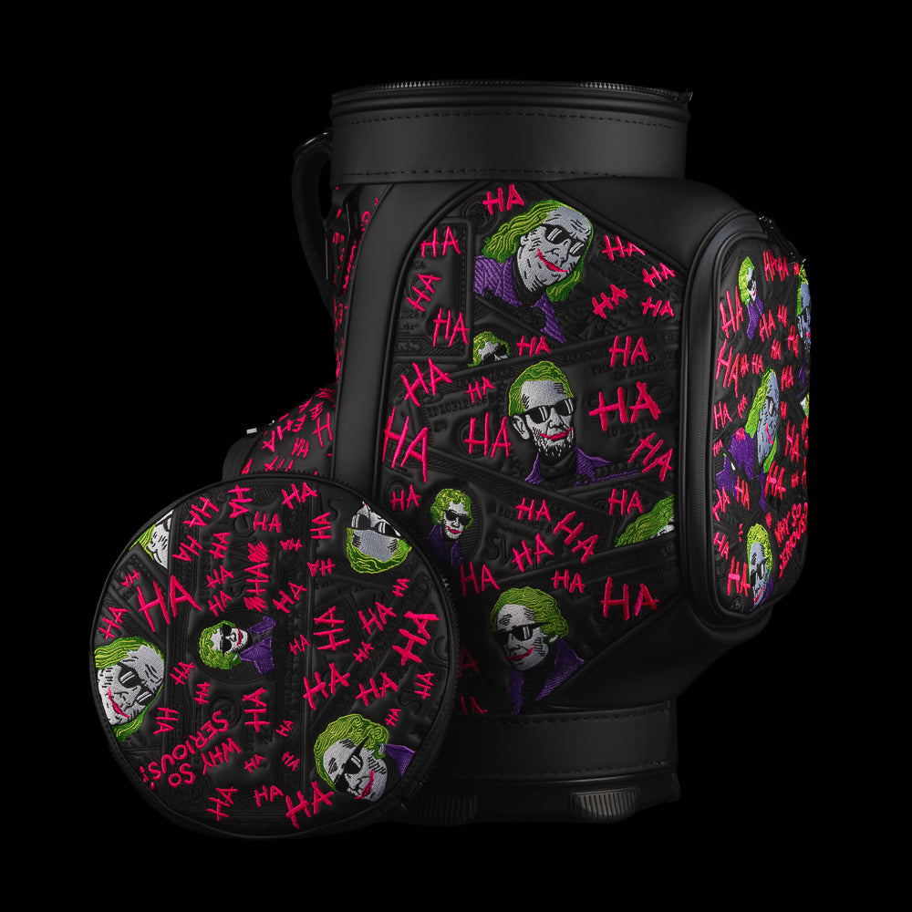 SWAG Golf Defaced Dollar Bills Den Caddy Cooler with colorful currency portraits, pink graffiti on black, and detached patterned lid.