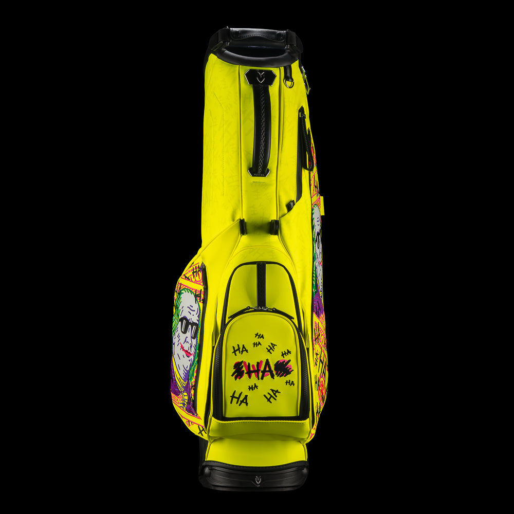 SWAG Golf x Vessel VLS Lux golf stand bag with neon yellow material and embroidered Defaced Franklin design on pink dollar bill themed panels.