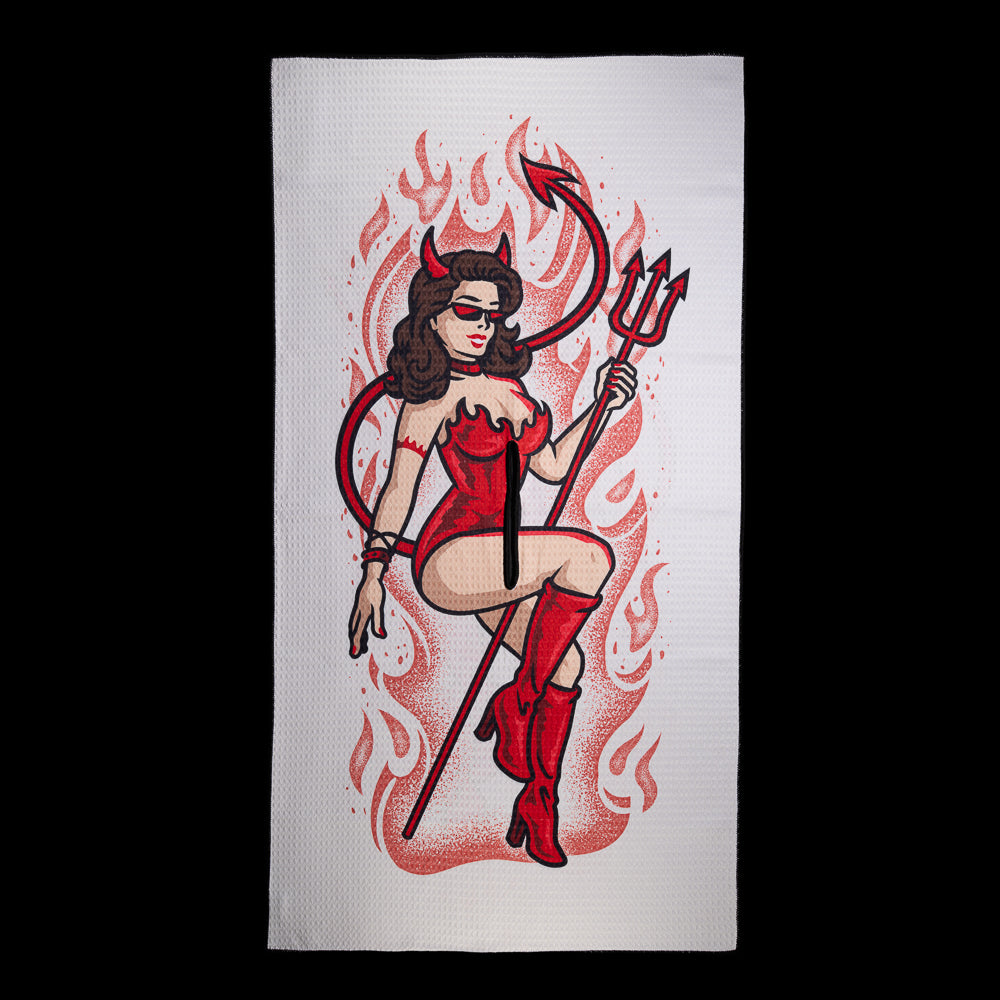 SWAG Golf Devil Pin Up golf towel in white with a red devil woman holding a pitchfork, surrounded by red flames.
