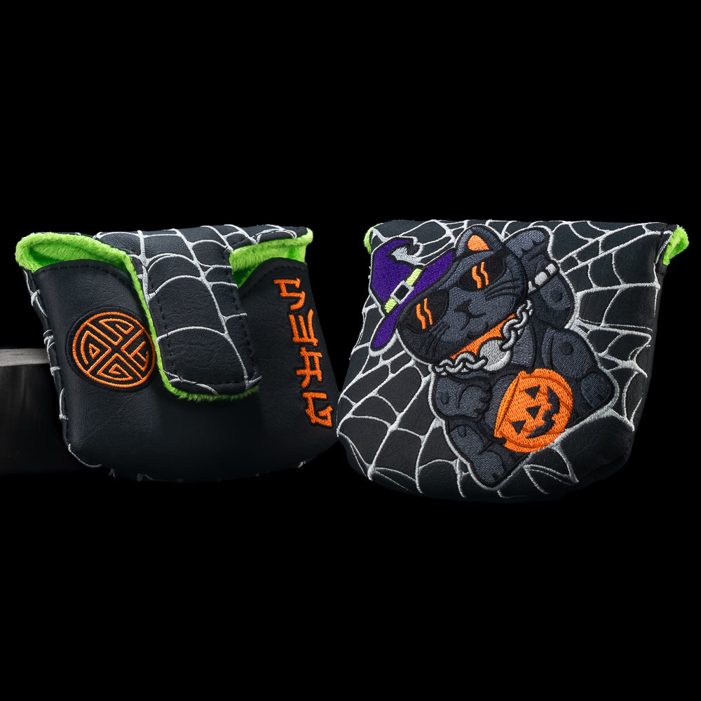 Two views of the SWAG Golf Unlucky Cat mallet cover with a black cat in a purple witch hat, orange pumpkin bucket, white webs, and green lining.