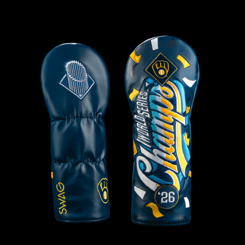 Front and back views of a navy blue golf club headcovers displayed side by side against a black background. The back features a white World Series trophy logo, and the right cover features a blue and yellow Milwaukee Brewers World Series Champs graphic.