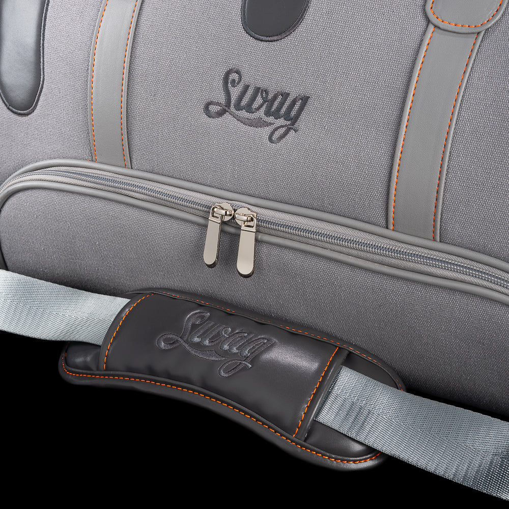 Close-up of SWAG Golf Dripping Duffle Bag zipper pocket and strap pad with embroidered SWAG logo and premium stitching details.