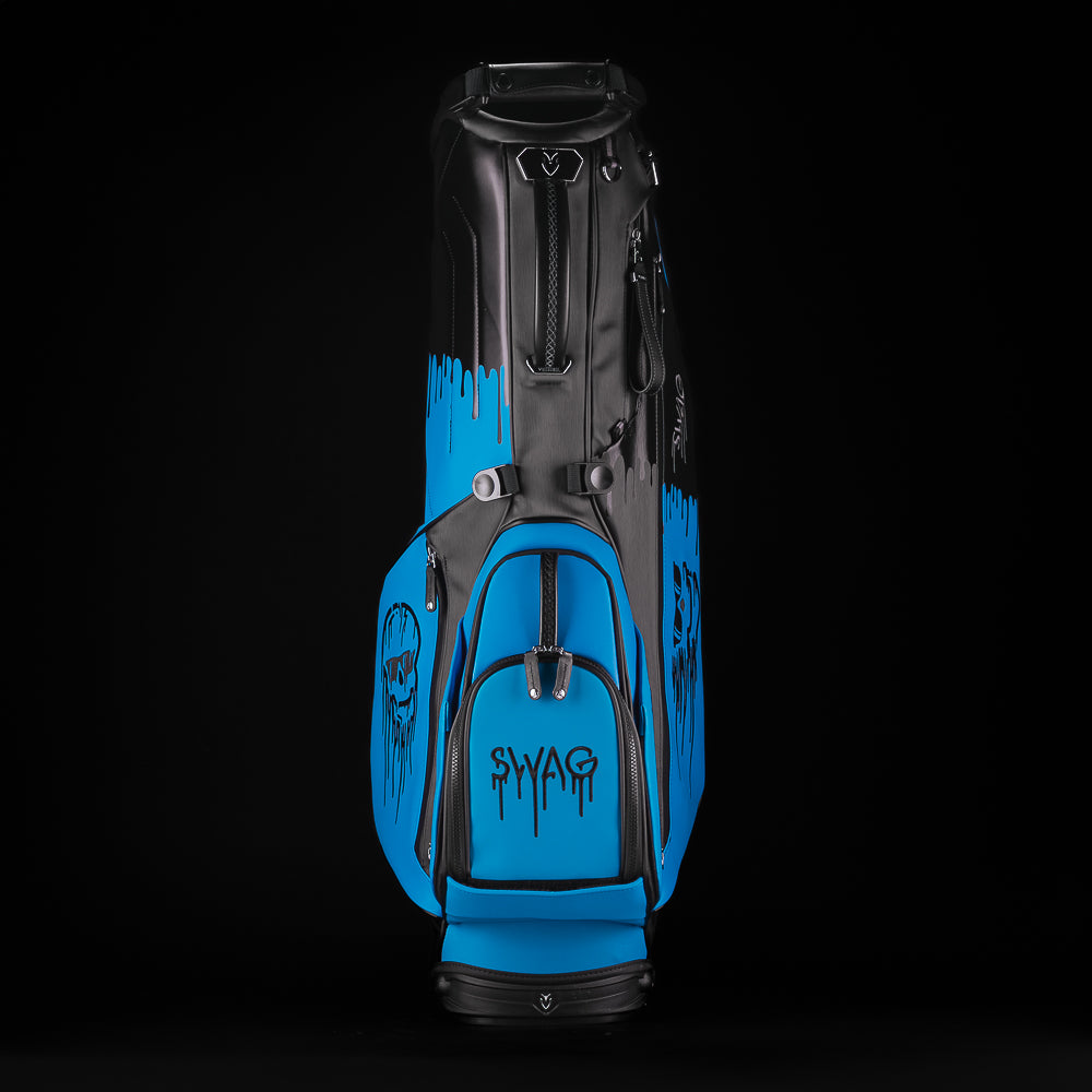 Blue and black SWAg Golf x Vessel golf stand bag with 'Don't Give a Putt' and 'Swag' text on a black background