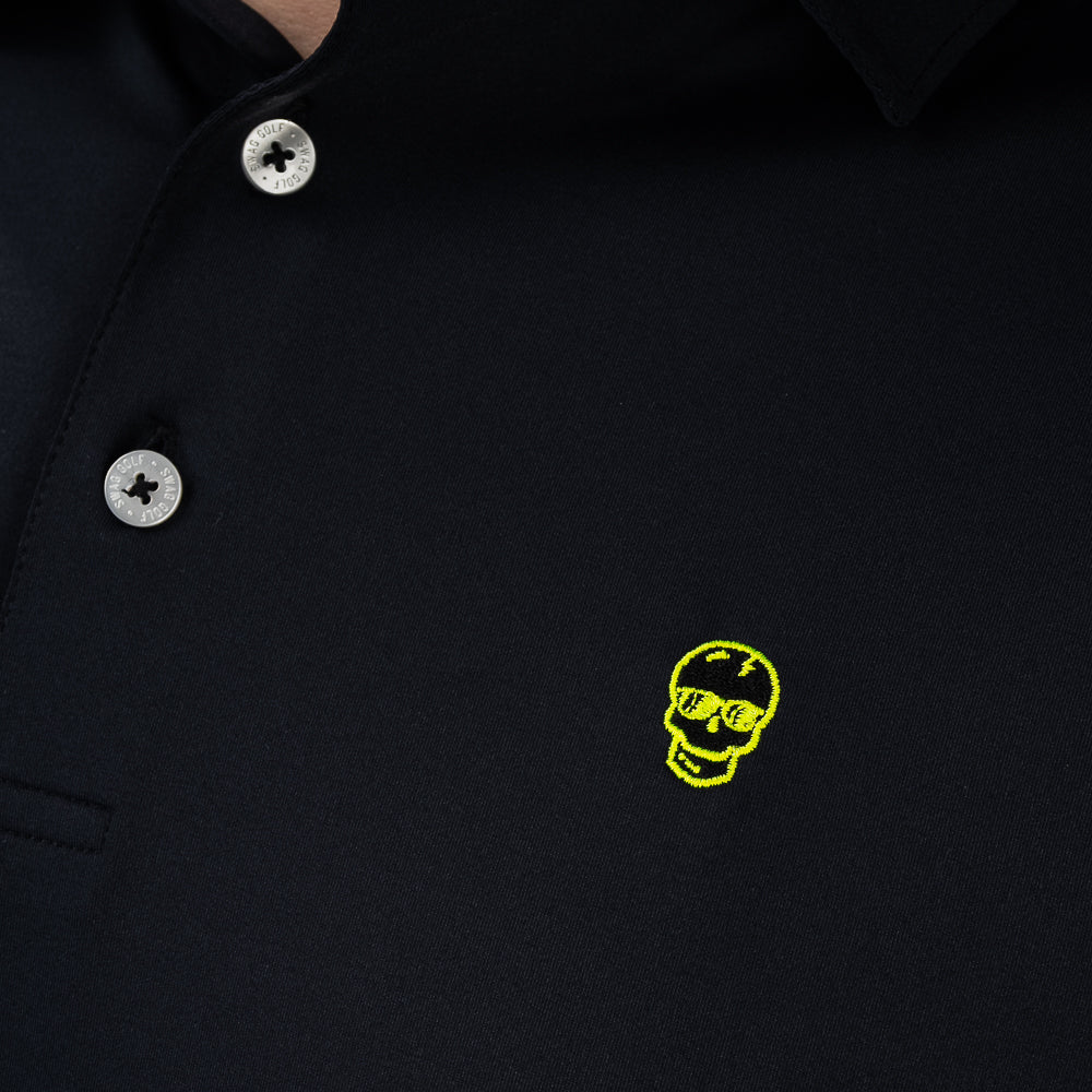 Close-up of embroidered neon skull logo on SWAG Golf Black Skull Classic Polo performance golf shirt featuring signature SWAG skull graphic