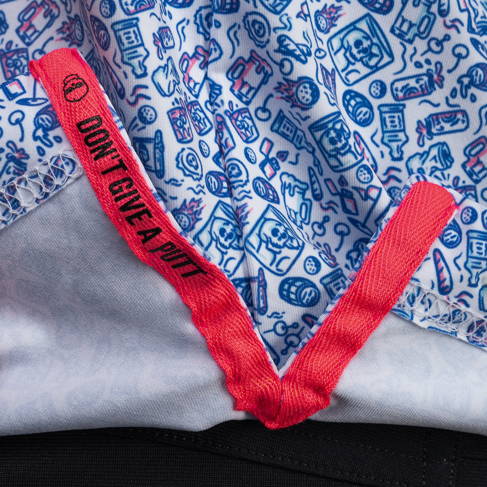Interior detail of SWAG Golf On The Rocks Classic Polo featuring signature Don't Give A Putt embroidery tape in vibrant pink accent color