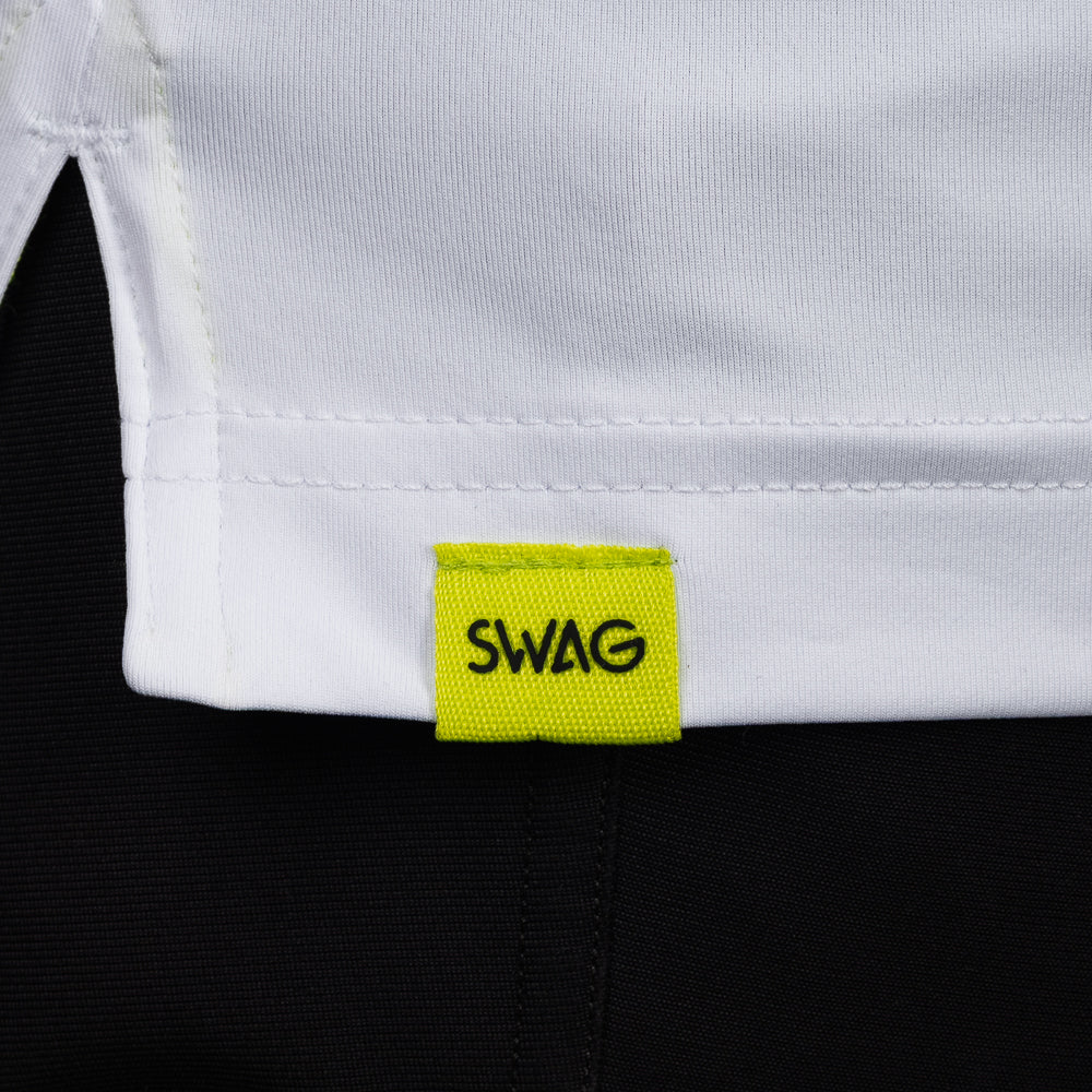 SWAG Golf White King Classic Polo hem detail with signature SWAG woven tag on performance golf shirt