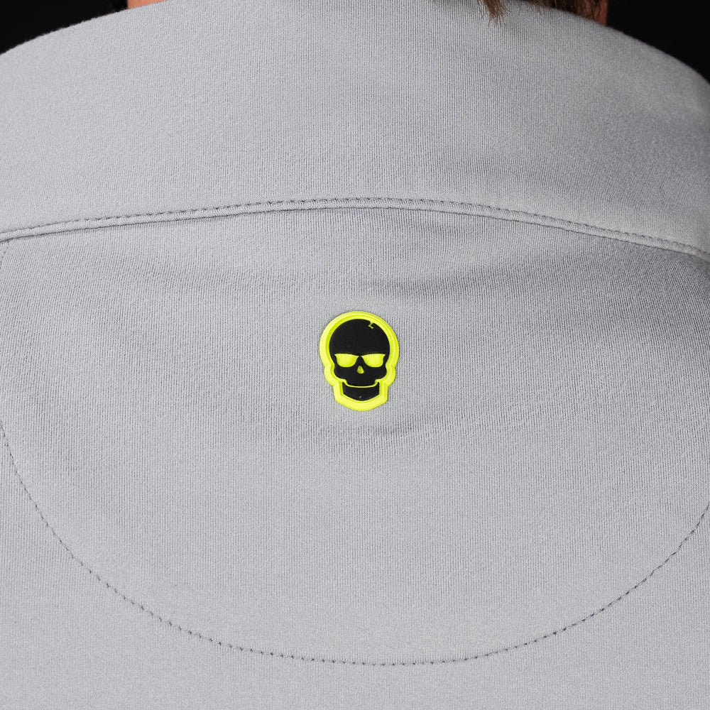 Close-up of embroidered SWAG Golf skull logo on Gray Club Quarter-Zip performance golf pullover