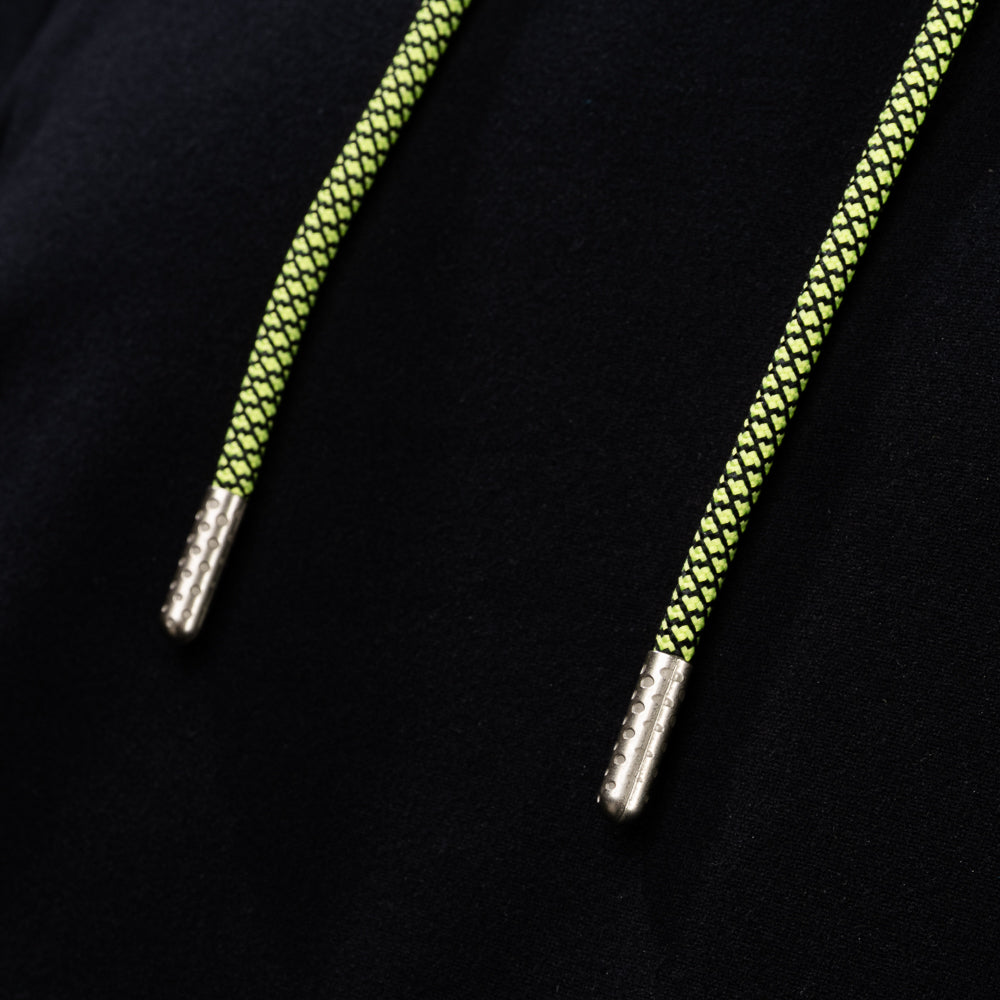 Close-up of neon braided drawstrings with metal tips on the SWAG Golf Black Lounge Hoodie
