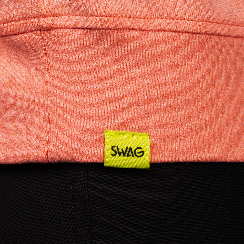 SWAG Golf Heathered Peach Lounge Hoodie hem detail featuring the signature neon SWAG woven label