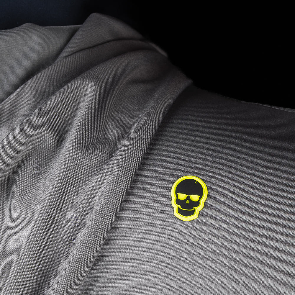 Close-up of embroidered SWAG Golf skull logo on Gray Player Hoodie performance golf hoodie