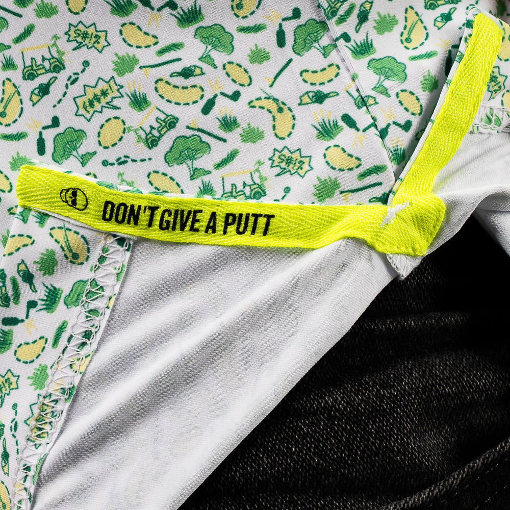 SWAG Golf men's short sleeve classic golf polo shirt with an allover green and yellow sand pits micro print design.