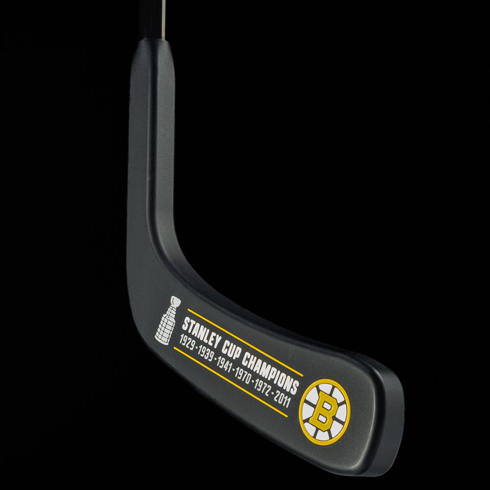 Boston Bruins blade putter engraved with Stanley Cup championship years and team logo