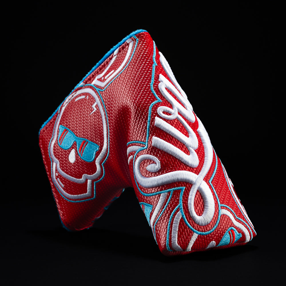 Red Swag Cola with blue and white blade golf club headcover.