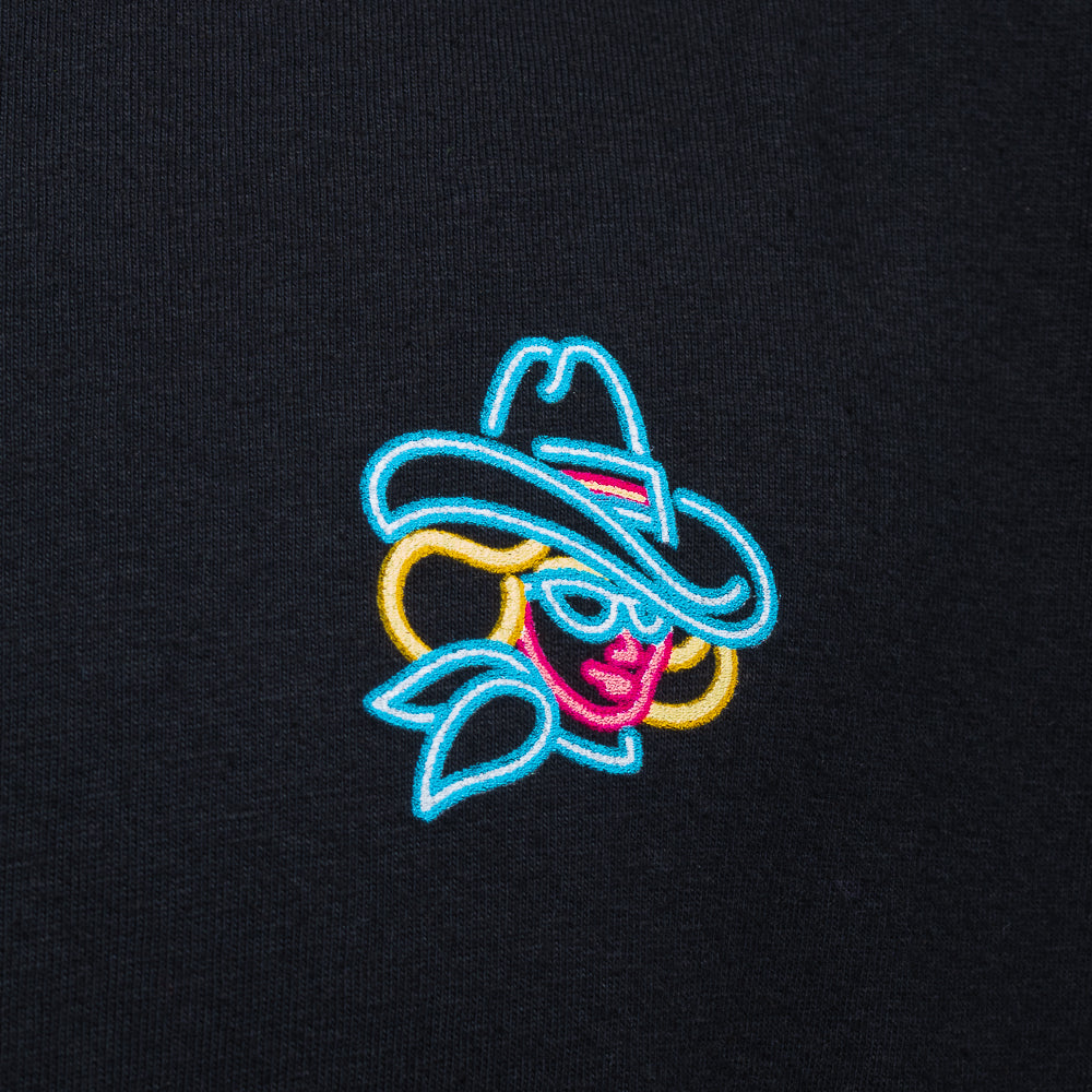 SWAG Casino Cowgirl T-Shirt in black with neon cowgirl back graphic and small chest detail.