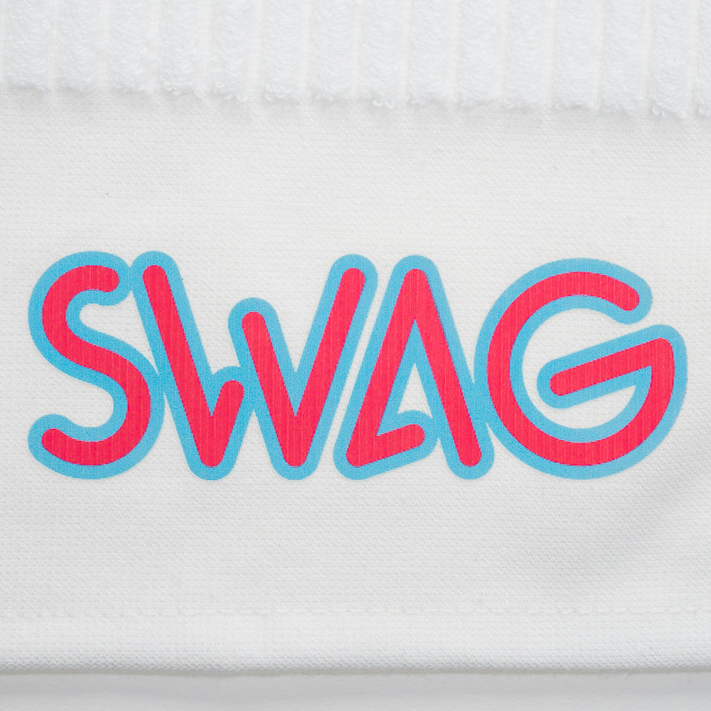 White towel with colorful stripes and 'SWAG' branding on a black background