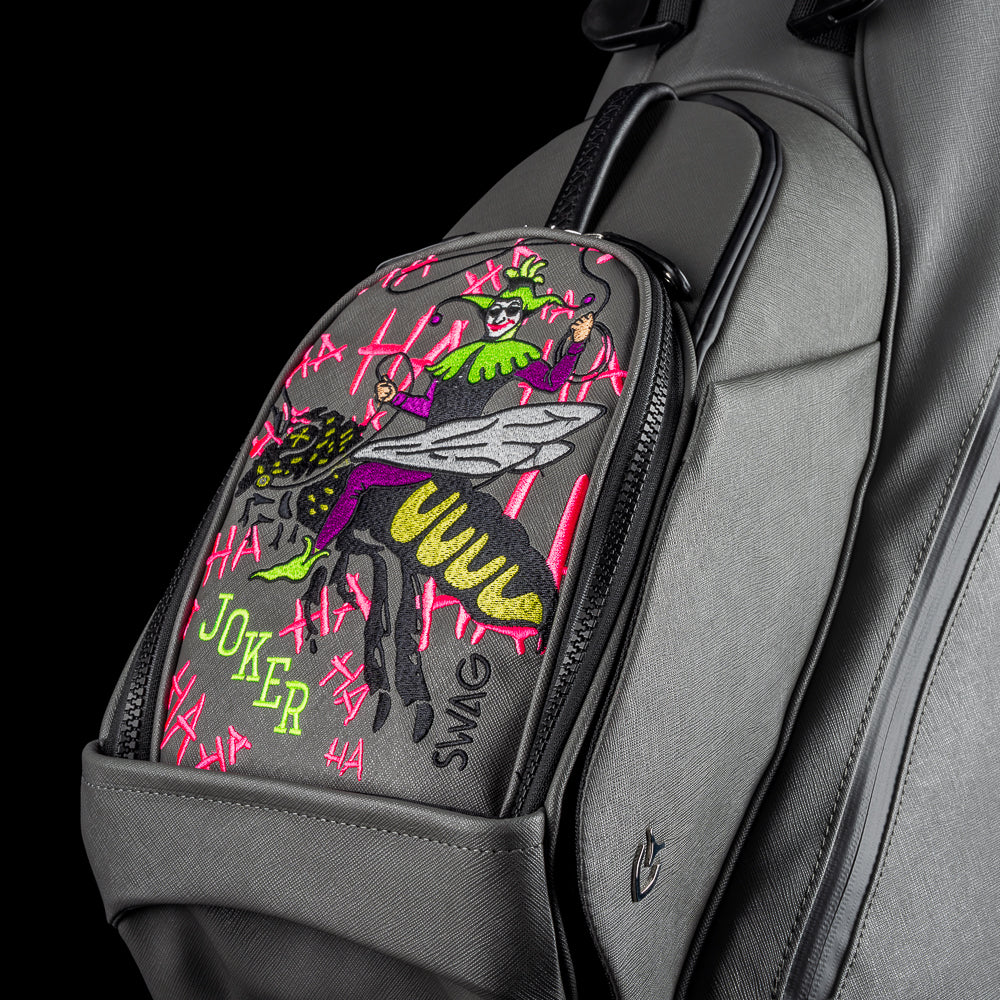 SWAG x Vessel VLS Lux grey golf stand bag with a Defaced Joker embroidered ball pocket panel.