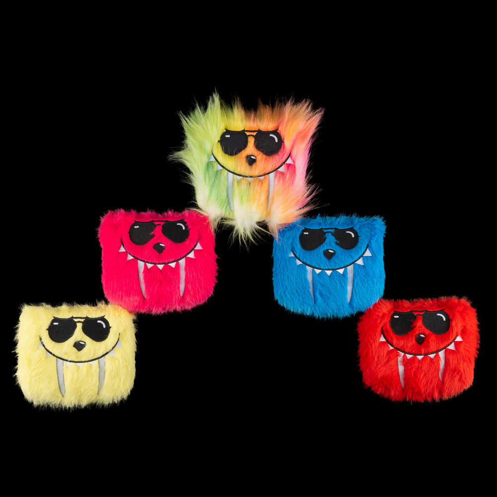 Group of five fuzzy SWAG Golf LaBooster mallet covers featuring monster faces in various bright colors and patterns.