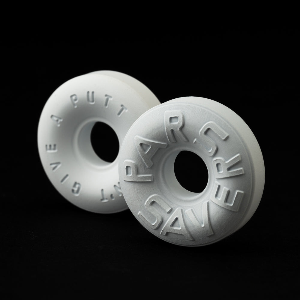 Stainless steel round Ball Marker with raised “Par-Savers” text and a central cutout.