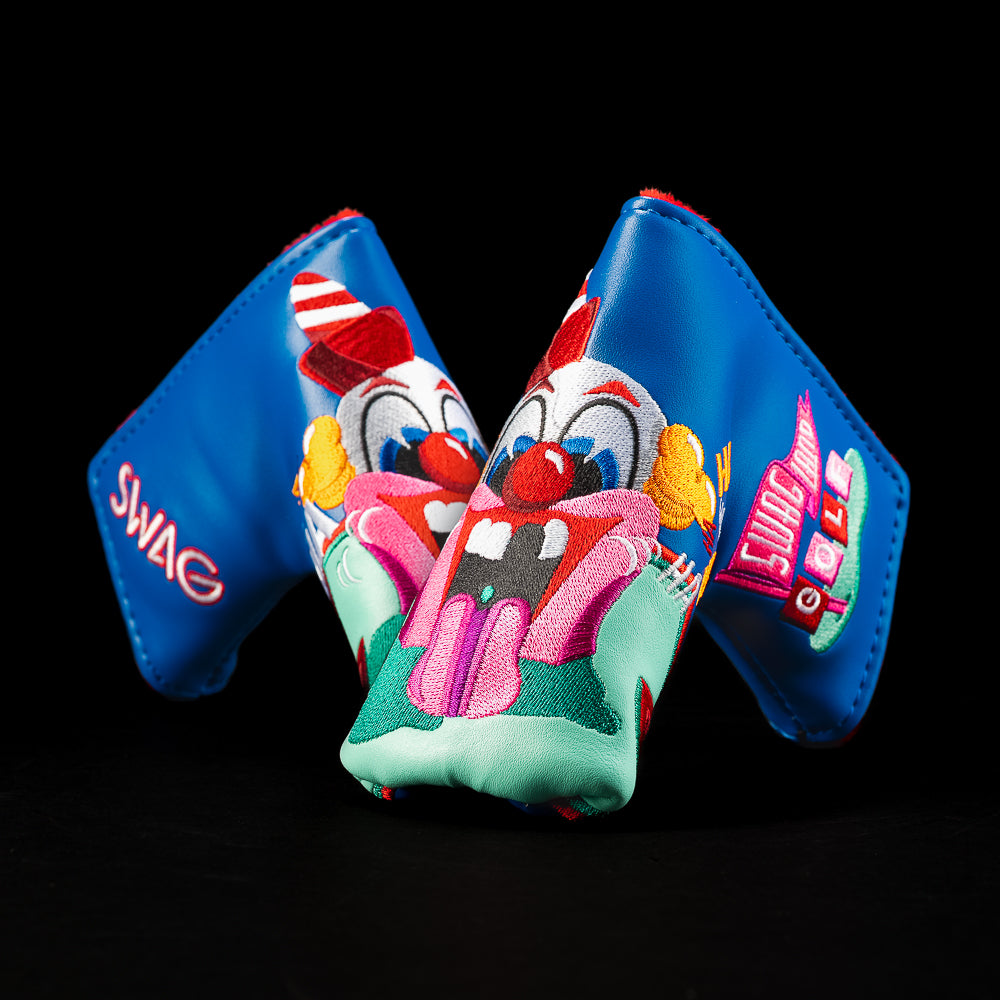 Clown blade cover with bright blue panels, embroidered clown face, and arcade-style “SWAG LAND GOLF” side art.