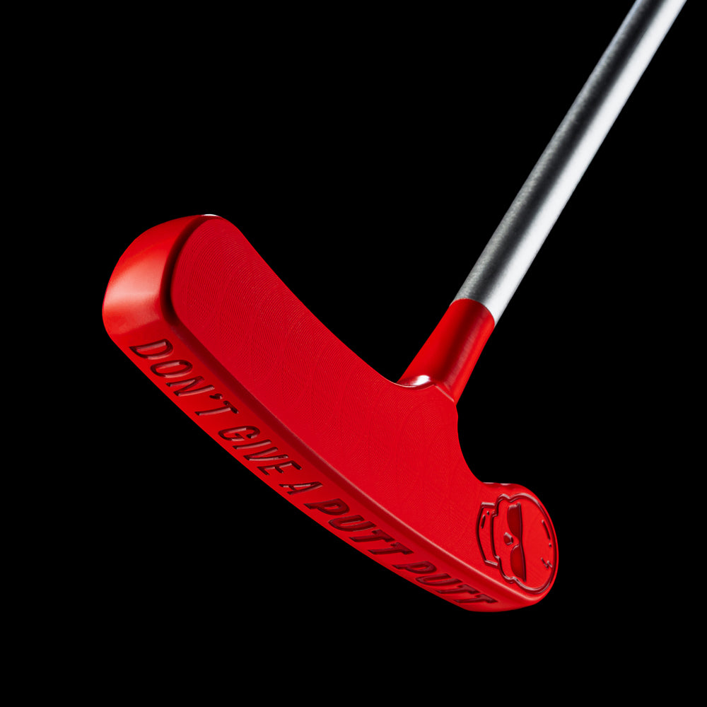 Red Putt-Putt squirt blade putter showing “Don’t Give a Putt-Putt” sole engraving and aviator skull engraved.