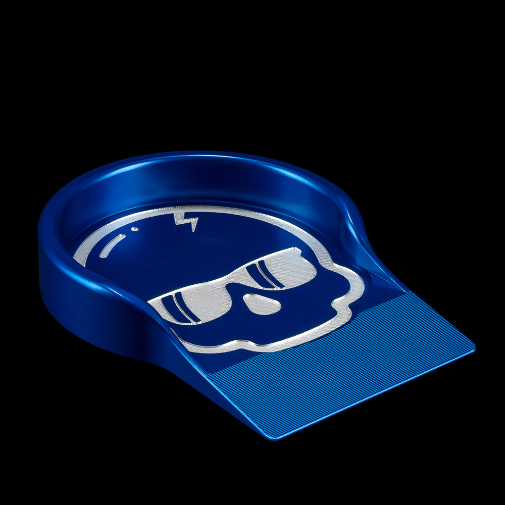 Blue aluminum SWAG Golf skull putting training cup on a black background