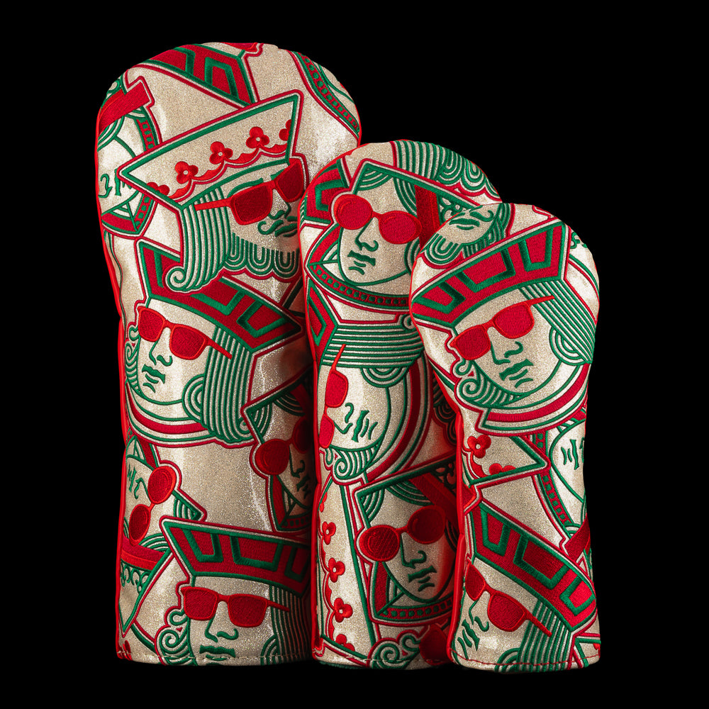 Holiday-themed SWAG Golf headcovers in varying sizes, decorated with stacked king and queen faces in red and green with sunglasses.