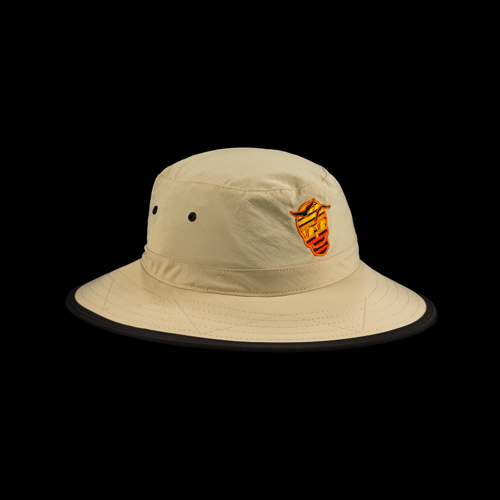 Beige bucket hat with a SWAG sunset skull logo on a black background