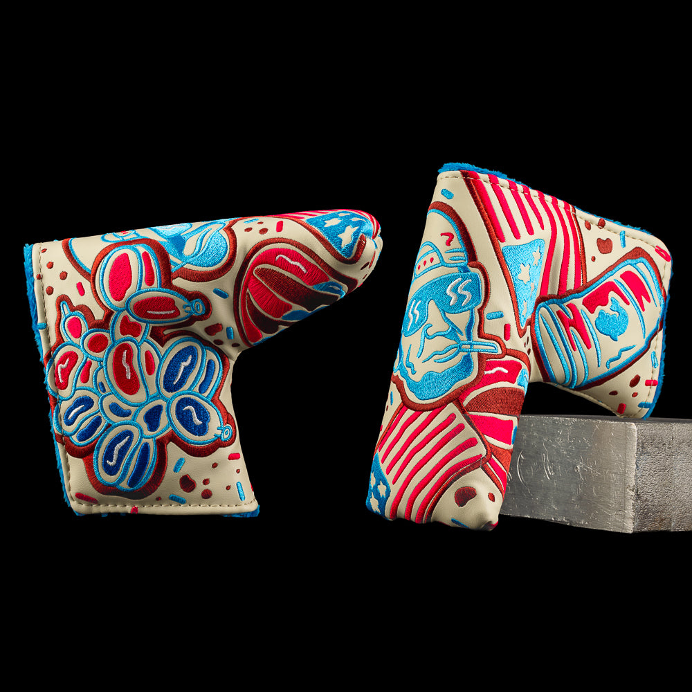 Holiday cookie-themed SWAG Golf blade putter headcovers with red, blue, and teal designs.