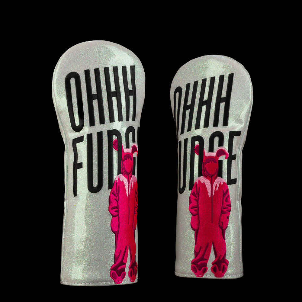 White glitter-style fairway cover with bold black “Ohhh Fudge” text and pink bunny-suit graphic.