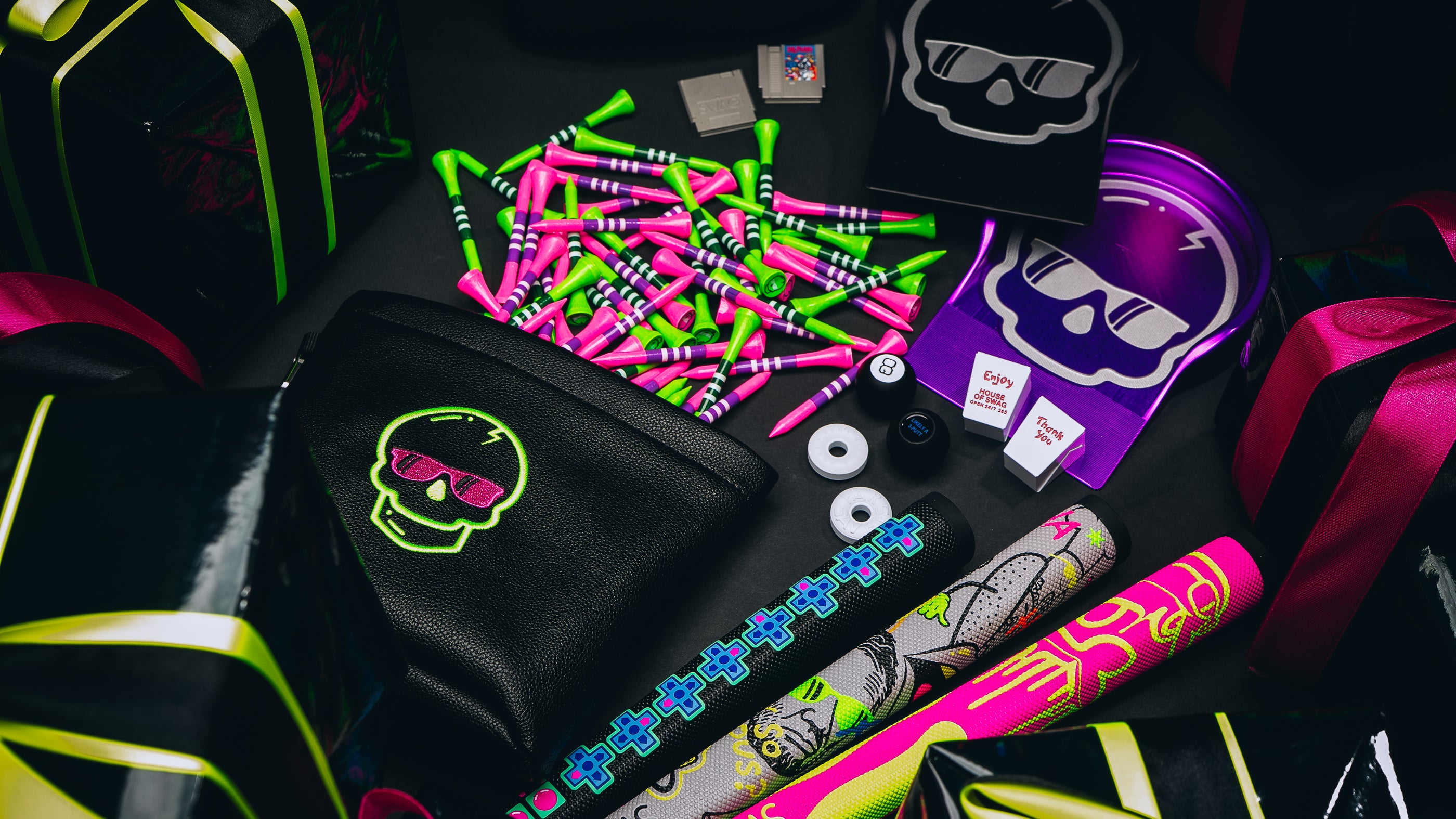 SWAG Golf accessory gift guide featuring ball markers, tee pouch, grips, putting cups, Vessel stand bags, and more.