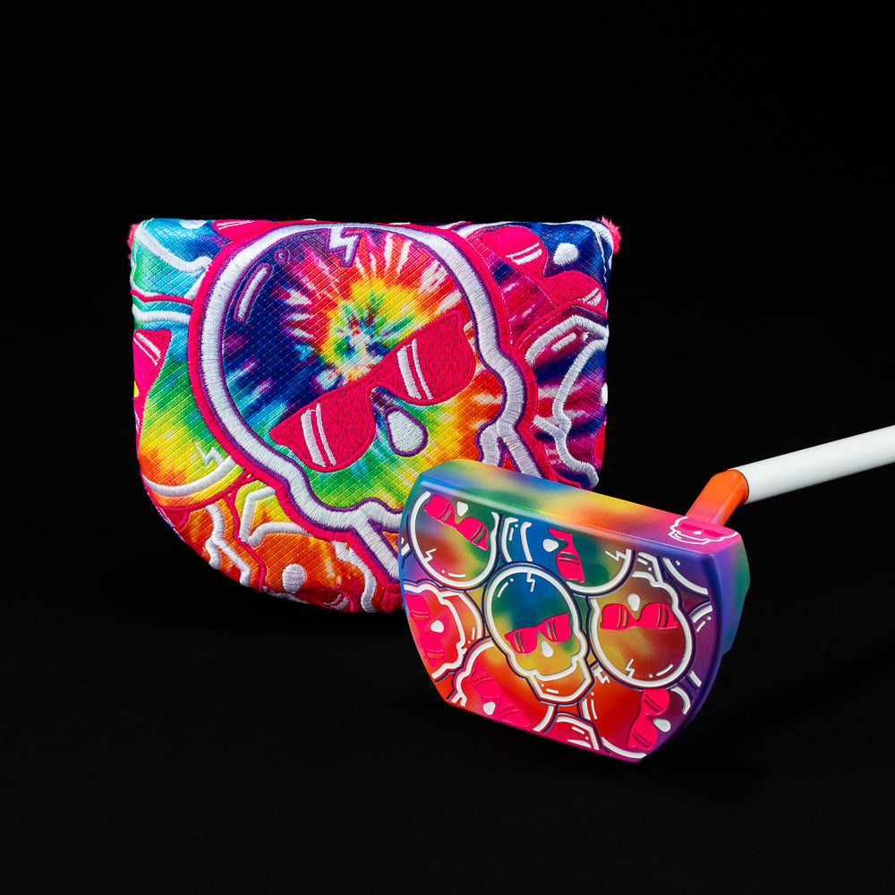 A putter with a tie-dye design featuring multiple colors and a skull motif, paired with a matching cover.