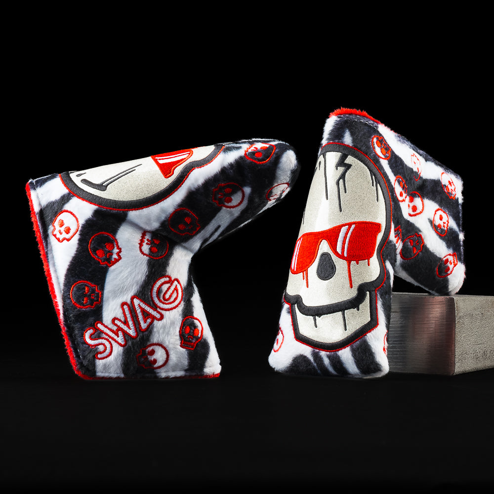 Show Must Go On furry black and white striped putter blade golf club headcover with white skull with red sunglasses.