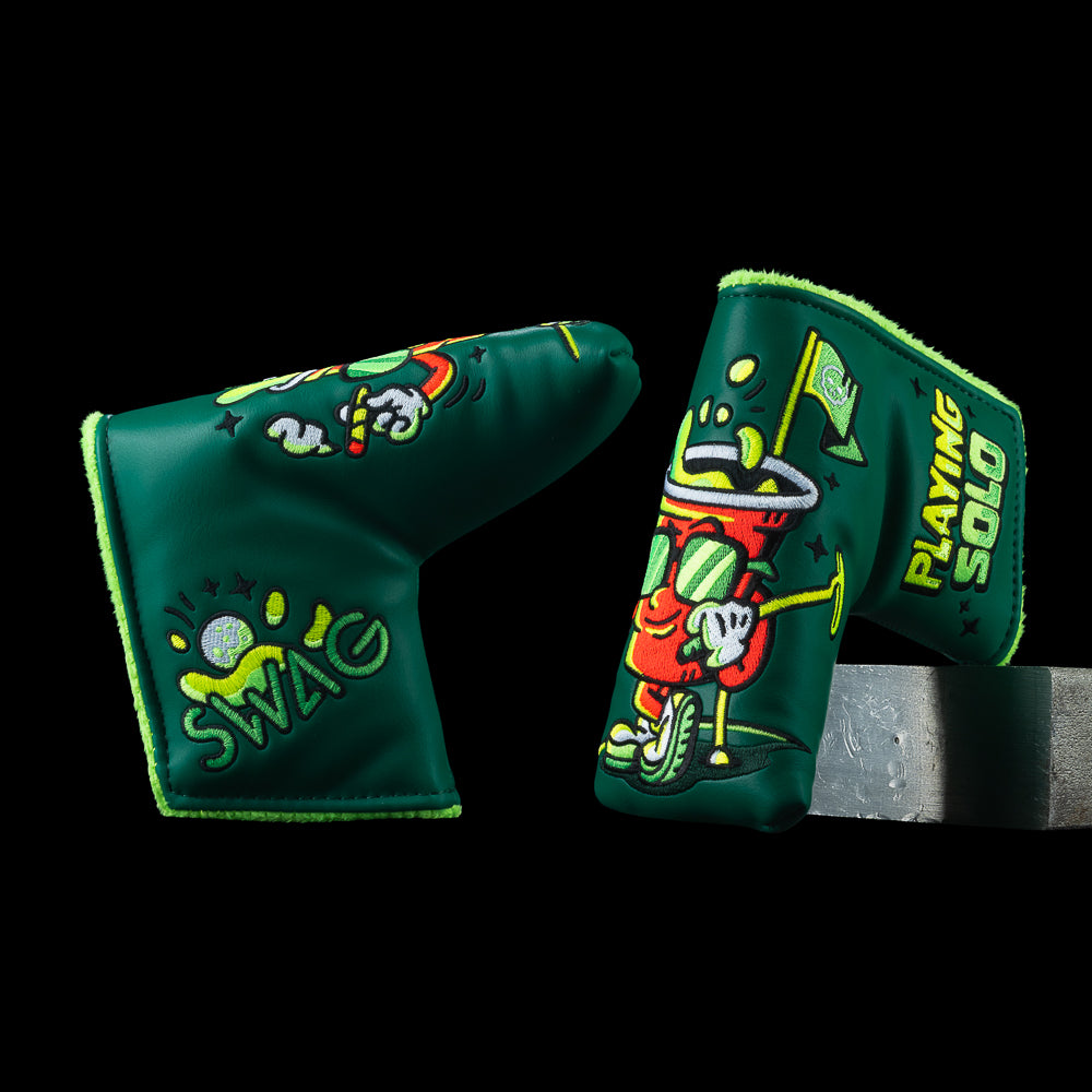 SWAG Golf Playing Solo blade putter cover featuring a bold solo character graphic on a dark green background with PLAYING SOLO Graphic and SWAG logo.